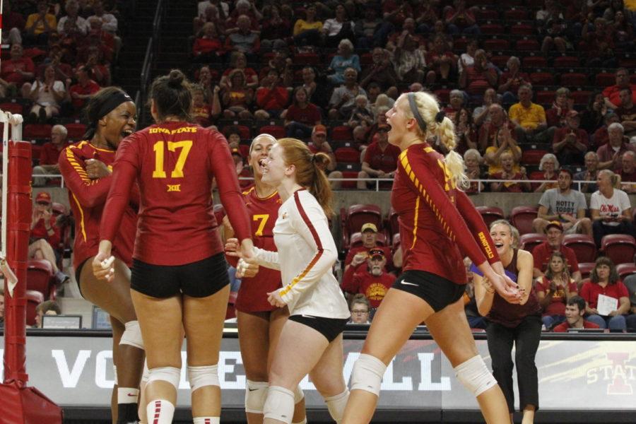 Cyclone volleyball team cheers as they score a point against Ole Miss during their Aug. 24 game in Hilton Coliseum. Cyclones won 3-0.
