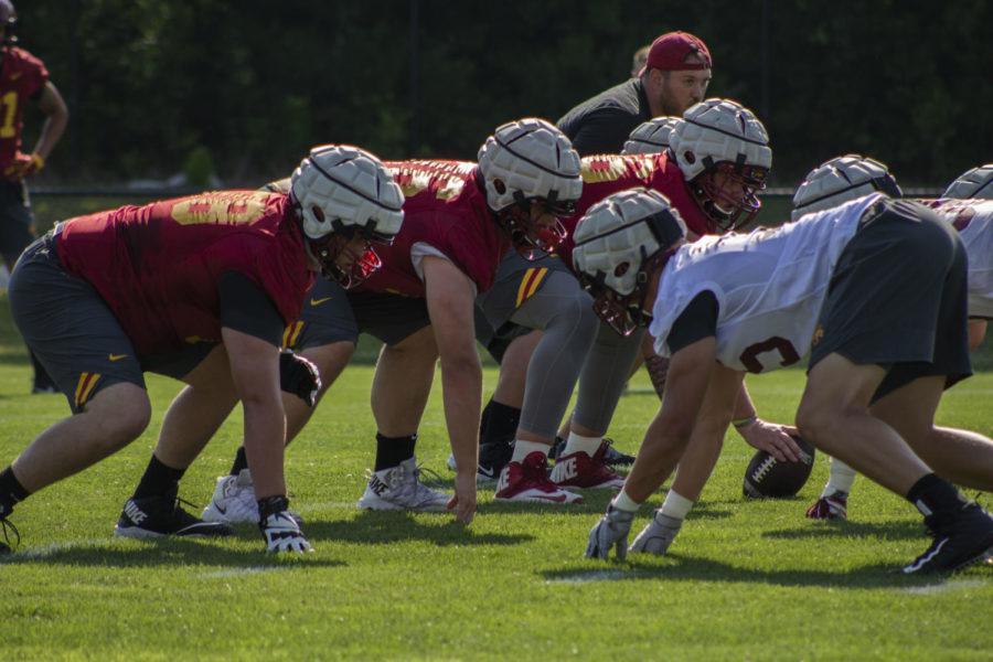 The offensive and defensive line face off in a scrimmage as a part of the first day of fall football camp on Aug. 3 on the Johnny Majors Practice field.