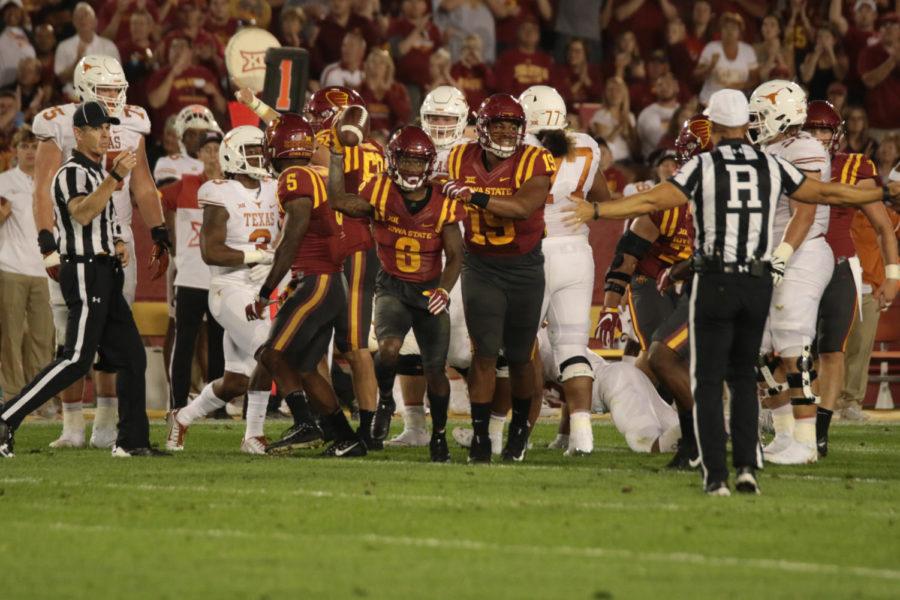 Iowa State junior DeMonte Ruth hold the ball up in the air after grabbing a fumble early in the game against Texas.