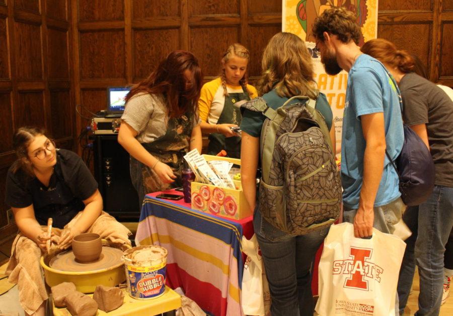 Students gather around to see all of what the Memorial Union Workspace has to offer during WelcomeFest in the Memorial Union on Aug. 22.