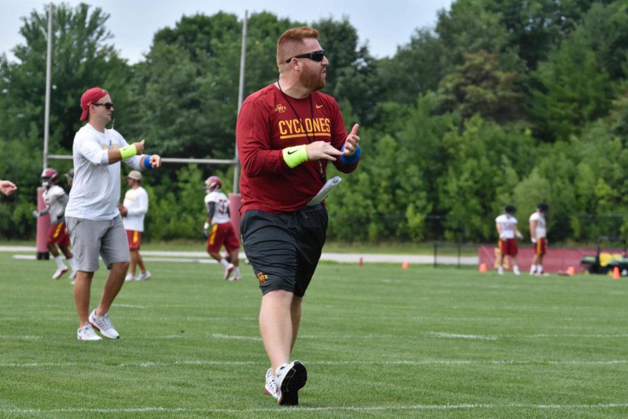 Tight ends/recruiting coordinator Alex Golesh yells to the offense during practice on Aug. 4.
