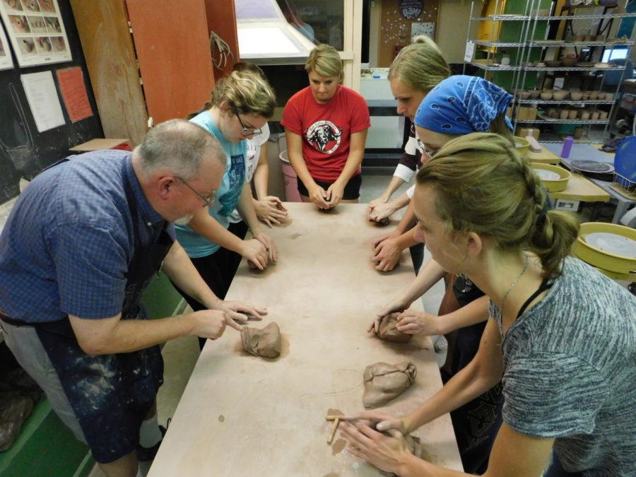 Greg Lamont, ceramist, instructs students on how to make their own pottery creations during a wheel pottery class in the Workspace on Aug. 30. Students learned how to make a bowl during the class. Lamont will be teaching how to glaze and finish pottery for the next eight weeks on Thursdays in the Workspace.