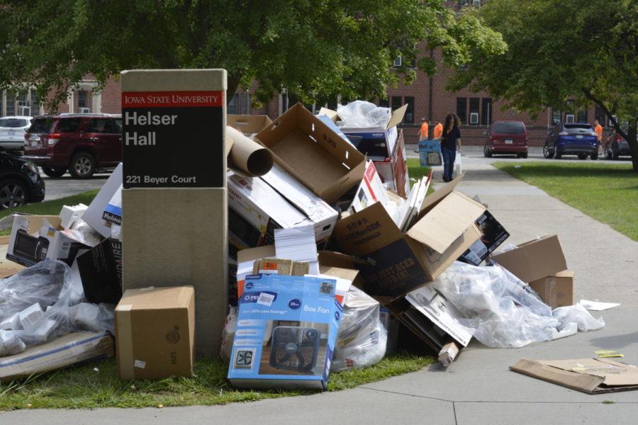 Waste accumulates outside of Helser Hall opposite of a overflowing dumpster as freshman move in to their new dorms on Aug. 15.