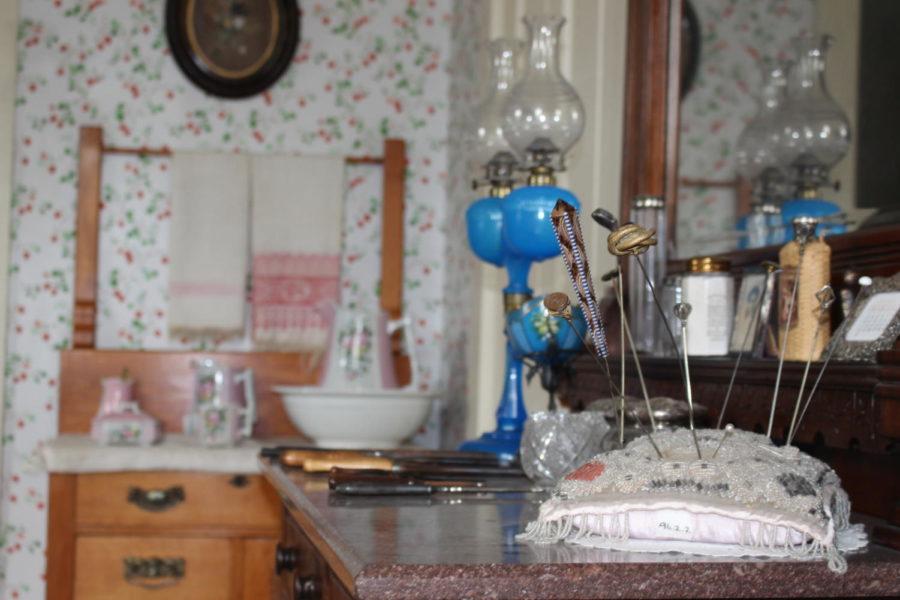 A pin cushion next to sewing tools on a vanity at the Farm House Museum on Aug. 30.
