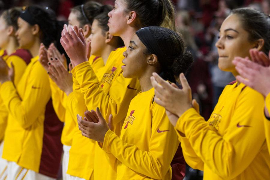 Members of the Iowa State Basketball Team claps following the national anthem before the start of the Iowa State Vs UC Riverside basketball game Dec 17. The Cyclones Defeated Riverside 89-66