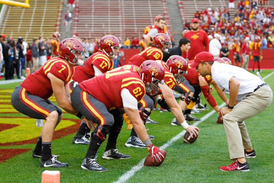 Head coach Matt Campbell warms up with the offensive line before a game against the Baylor Bears, Oct. 1 in Jack Trice Stadium. After having a seven point lead at halftime, the Cyclones would go on to give to lose off a last second field goal, 45-42.