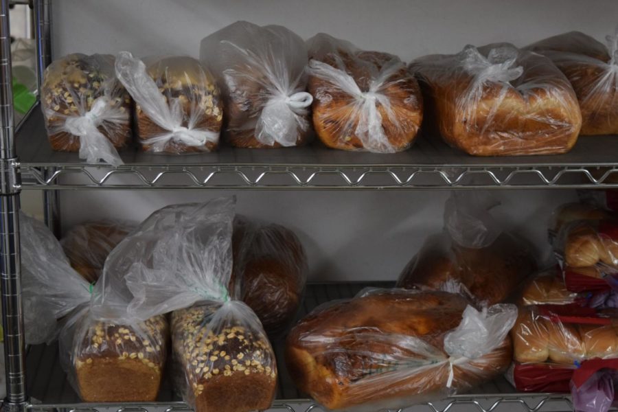 Racks of bread and other bakery goods are available in the Food at First market, donated by local restaurants and grocery stores. Founder Dale Vander Schaaf calls it a recycled food program. 