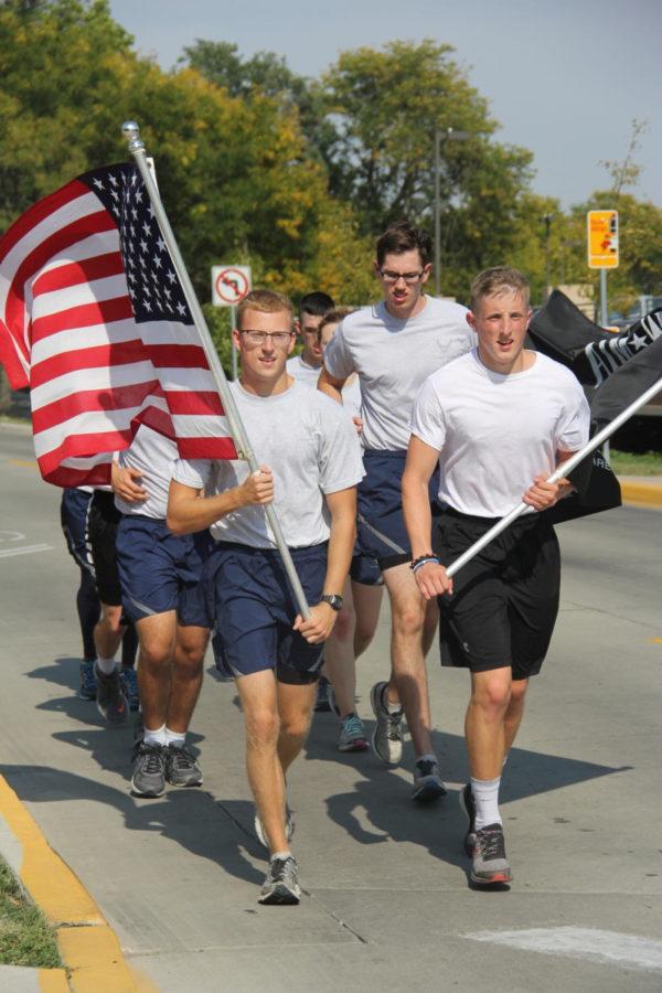 Members of Iowa State Air Force ROTC approach the Memorial Union at the end of their run of those honored through POW MIA. Temperatures reached 93 degrees.