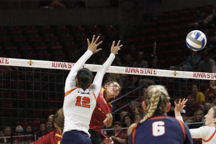 Candelaria Herrera, a middle blocker, hits the ball during the game on Sept. 16 in Hilton Coliseum. Cyclones lost 3-2.