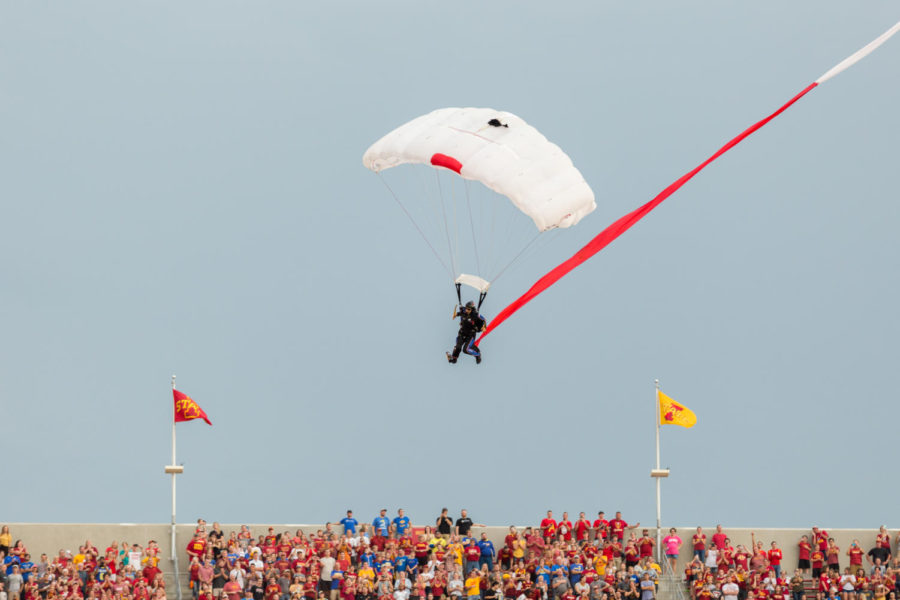 Skydiver lands in Jack Trice before the start of the Iowa State vs South Dakota Football game Sept. 1.