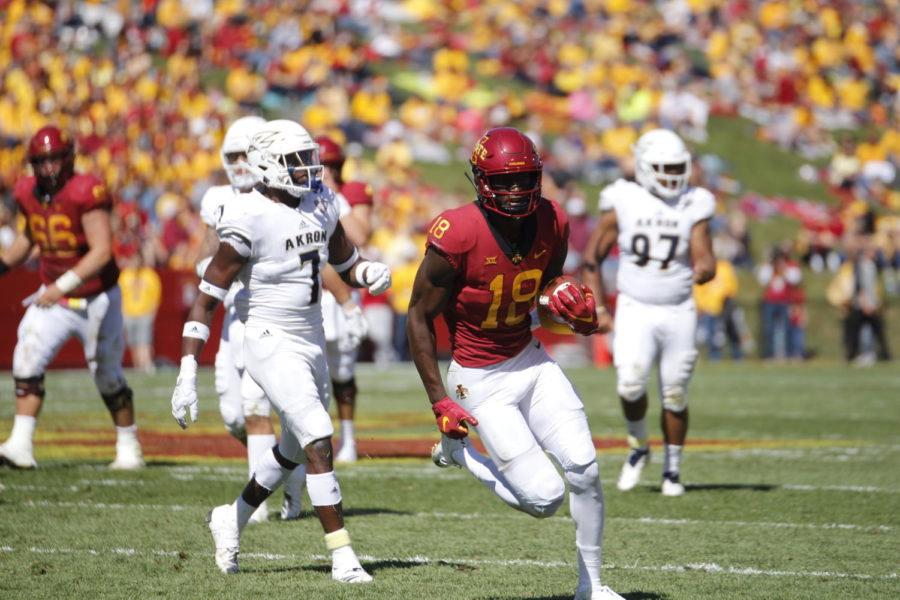 Junior Hakeem Butler, Iowa State wide receiver, runs past players for Akrons team during their game against the Zips on Sept. 22 at Jack Trice Stadium.