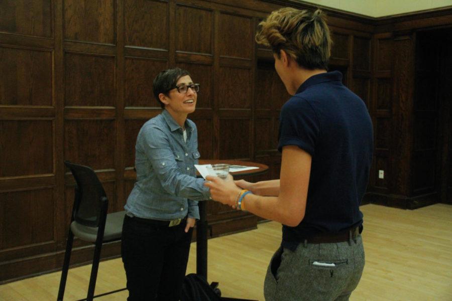 Danielle Feinberg shakes a students hand after her lecture about animation at the Memorial Union on Sept. 6. Feinberg is the Director of Photography for Lighting at Pixar Animation Studios and had a large role in the making of animated films such as Brave and Coco.