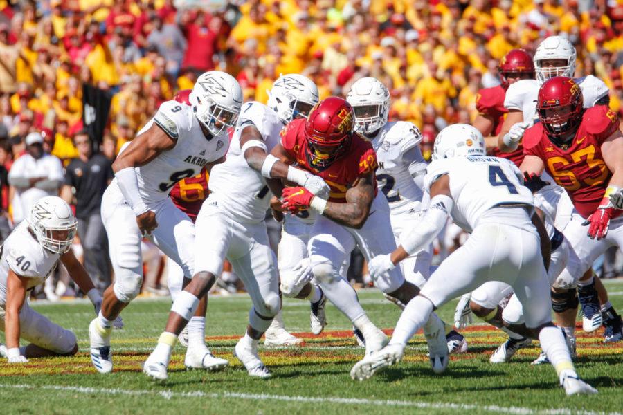 Iowa State running back David Montgomery plows through Akrons players during their game against the Zips on Sept. 22 at Jack Trice Stadium. The Cyclones won 26-13.