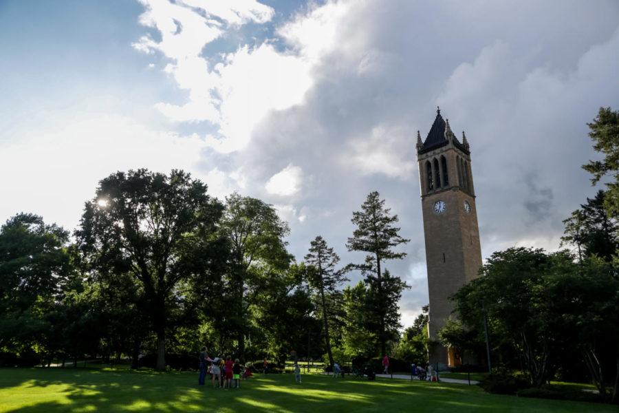 Members of the Ames Community gather around the Campanile June 26 to listen to Mark Konewko from Milwaukee, Wisconsin play the bells. Konewko played a total of 13 songs followed by a meet and greet session where listeners were invited up into the campanile for a tour.
