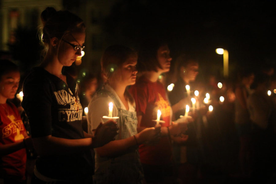 Students light candles to commemorate victims of 9/11 on Central Campus on Sunday, Sept. 11, 2011.