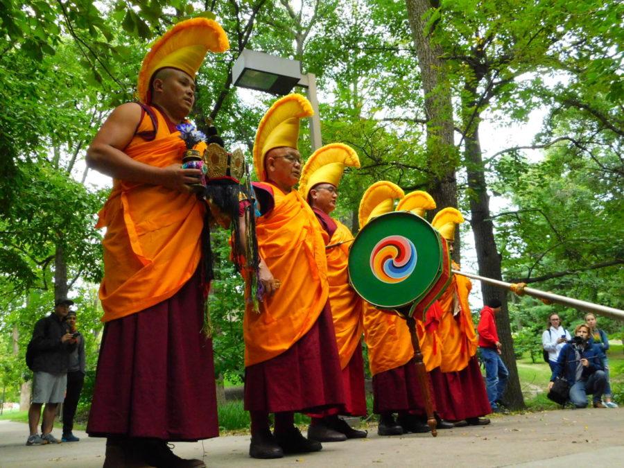 The Tibetan Monks before they release the sand into the stream to spread the energy of the mandala around the world near the Memorial Union on Sept. 28.