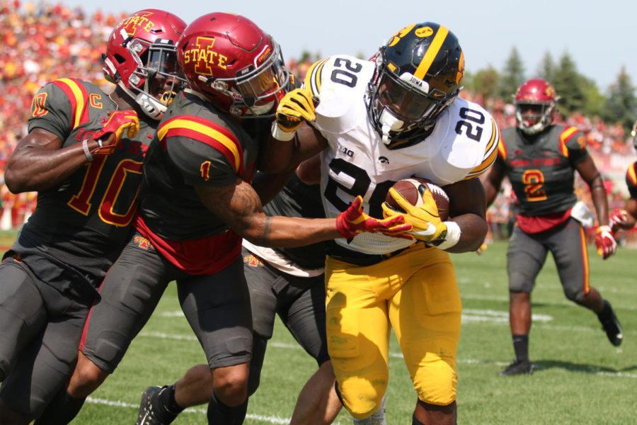 Iowa States DAndre Payne defends Iowas James Butler during the annual CyHawk football game Sept. 9, 2017. The Cyclones fell to the Hawkeyes 44-41 in one overtime.