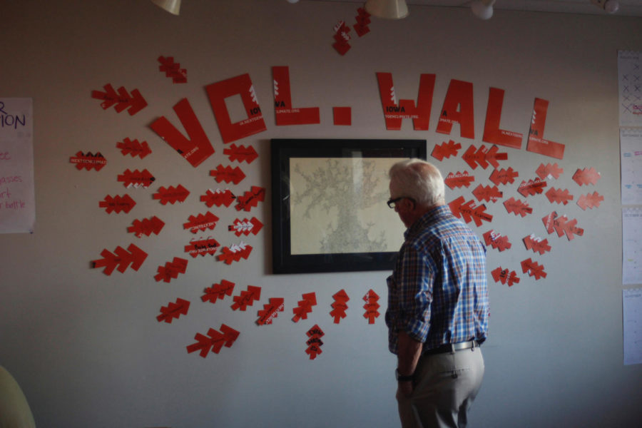 NextGen member looks at volunteer wall at their newly opened Ames office.