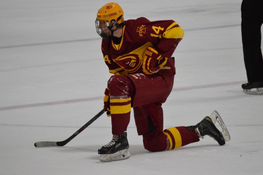 Iowa State Hockey player takes a breath as he stands up from being down. This was at Friday nights game against Waldorf University in the Ames ISU Ice Arena. 