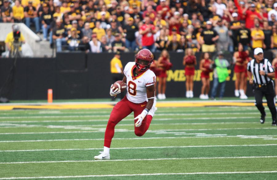 Wide receiver, Deshaunte Jones, runs the ball down the field during the football game against University of Iowa at Kinnick Stadium in Iowa City on Sept. 8. The Cyclones were defeated 13-3.