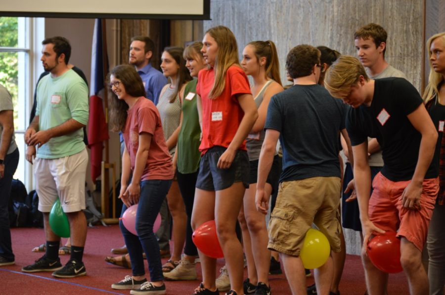 Students prepare for their next challenge, walking a balloon between their legs to their teammate on the other side of the room. The Student Organization Showdown was held in the campanile room of Memorial Union on Thursday night.