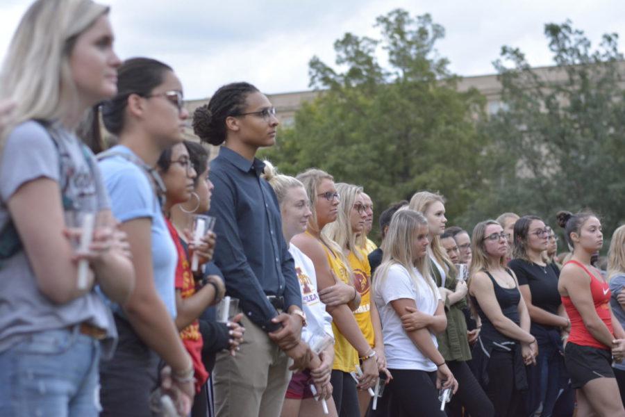 Members of Student Government listen to speakers during a vigil held in honor of Celia Barquín Arozamena on the north side of the Campanile on Wednesday night.