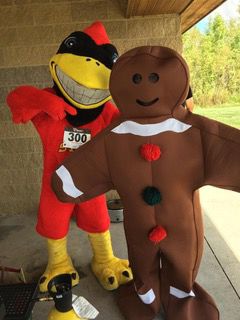 Cy posed with gingerbread mascot at the 2017 Gingerbread run/walk. 