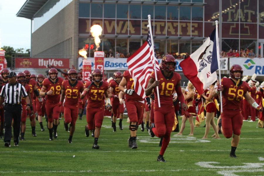 The Iowa State football teams runs onto the field to start their opening game against South Dakota State at Jack Trice Stadium on Sept. 1.