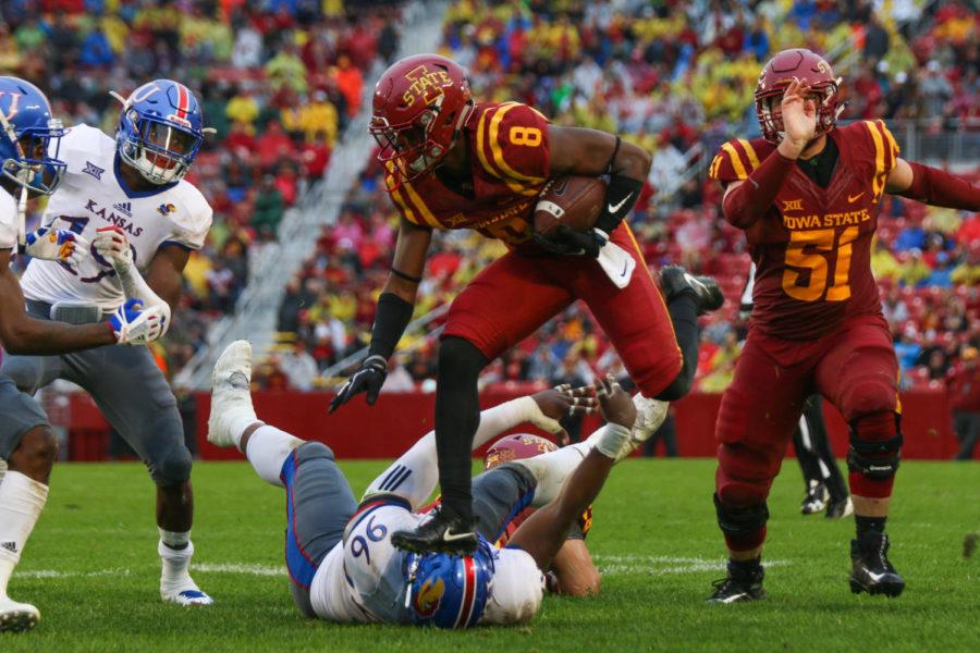 Iowa State wide receiver DeShaunte Jones leaps over Kansas Daniel Wise during the Cyclones 45-0 on Oct. 14, 2017.