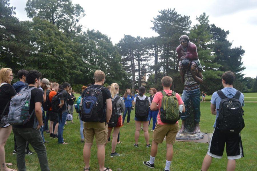 Students gather on central campus to hear Erin O'Malley explain "Border Crossing." This happened at this months Art Walk Wednesday afternoon. 