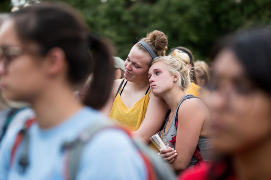 Members of the Iowa State community lean on each other before the start of the Candlelight vigil held in honor of Celia Barquín Arozamena Sept 19. 