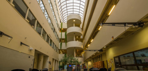 The atrium located in the Design building is open all the way up through five floors to the glass ceiling above. The Design building houses eleven different majors including graduate programs.