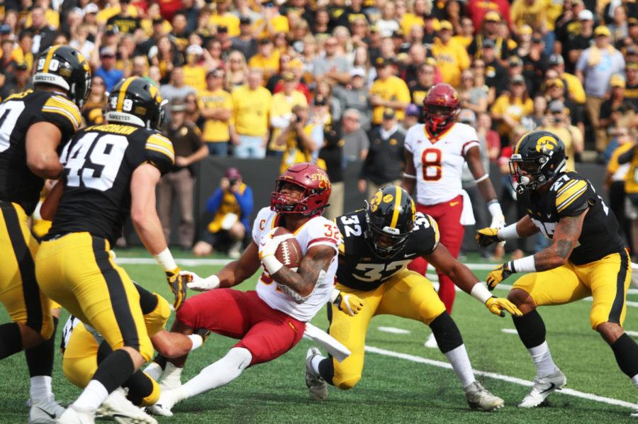 Running+back%2C+David+Montgomery%2C+is+brought+down+by+University+of+Iowa+football+players+during+their+game+at+Kinnick+Stadium+in+Iowa+City+on+Sept.+8.+The+Cyclones+were+defeated+13-3.