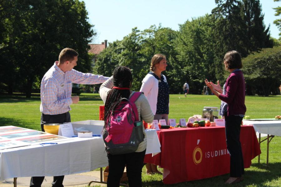 People come to celebrate ten years of dining and living green for ISU dining by getting a free cookie and apple on the East Marston Lawn on Sept. 10.