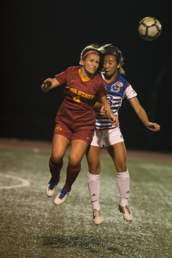 Midfielder Emily Steil heads the ball during the home opener for the Big 12 conference game versus Kansas on Sept. 29. The Iowa State soccer team lost 2-1.