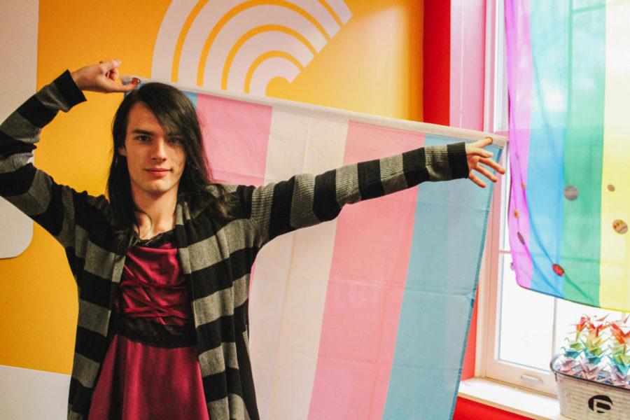Mia Massa displays the Trans pride flag at the National Coming Out Day photoshoot at The Center on Oct. 11. The month of October is LGBTQIA+ History Month. 