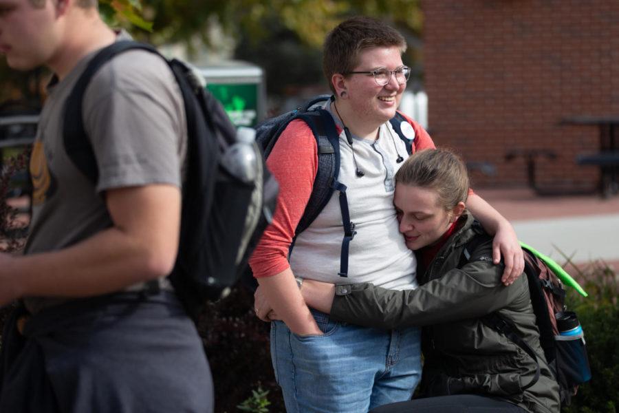 Siblings September and Kat Standing hug during the We #WontBeErased Demonstration held in the Free Speech Zone outside of Parks Library Oct. 26.