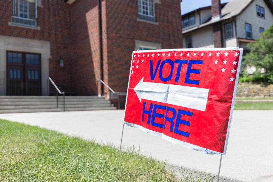 A sign is posted outside of Collegiate United Methodist Church on Lincoln Way to let members of the Ames community know that it is a voting location.