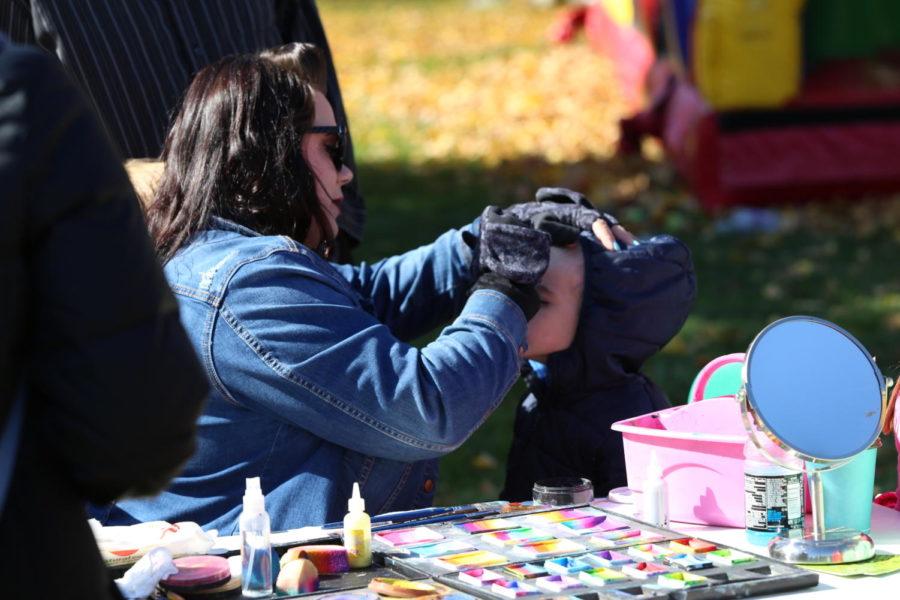 Cole Kincaid gets his face painted at the Homecoming Family Festival Oct. 20 on Central campus.