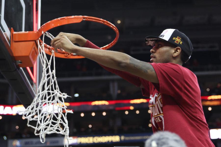 Monte Morris cuts down the net following Iowa States 80-74 win over West Virginia in the Big 12 Tournament Championship game. The Cyclones won their third Big 12 title in four years.