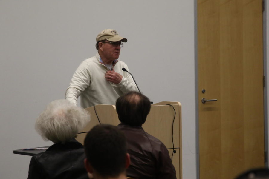 Dan Gable, former Iowa State wrestler, speaks at the Ames Public Library on Wednesday. Gable answered questions from the audience before signing copies of his book.
