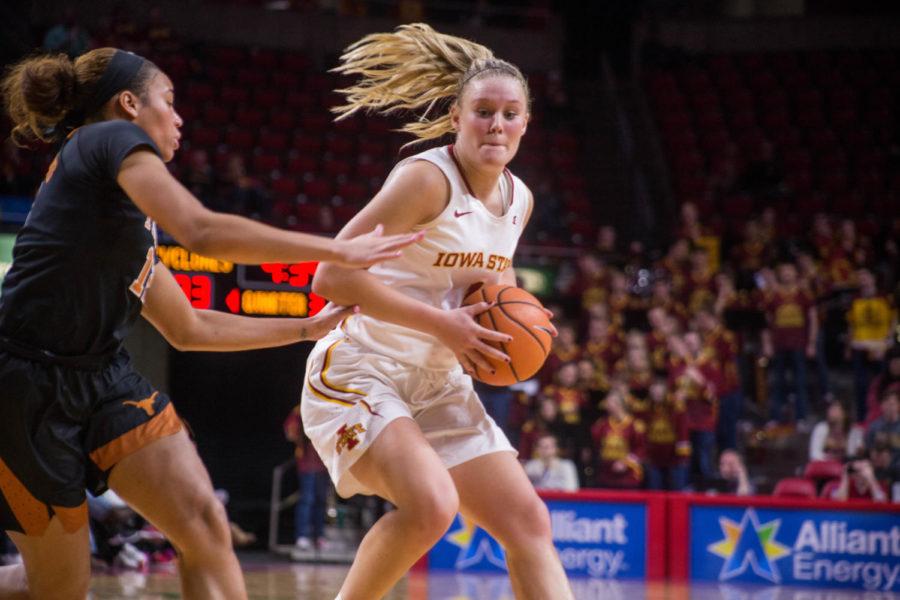 Then freshman Madison Wise looks for a pass during the game against the University of Texas on Feb. 24 at the Hilton Coliseum.