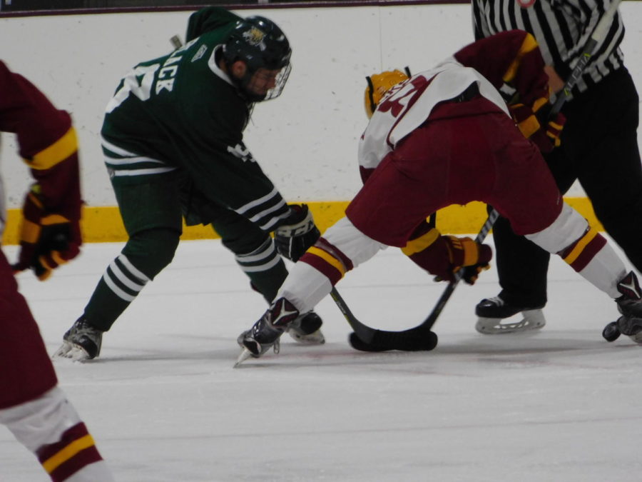 Jared Erickson, sophomore forward, faces off against an Ohio University player during the game at the Ames/ISU Ice Arena on Oct. 19. The Cyclones fought hard but lost 4-1 at the end.