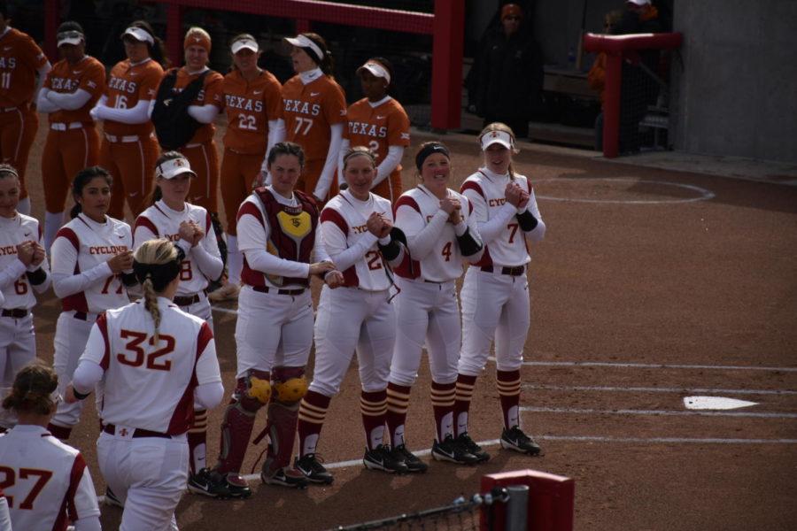 The Cyclone Softball team takes the field before their game against the Texas Longhorns.