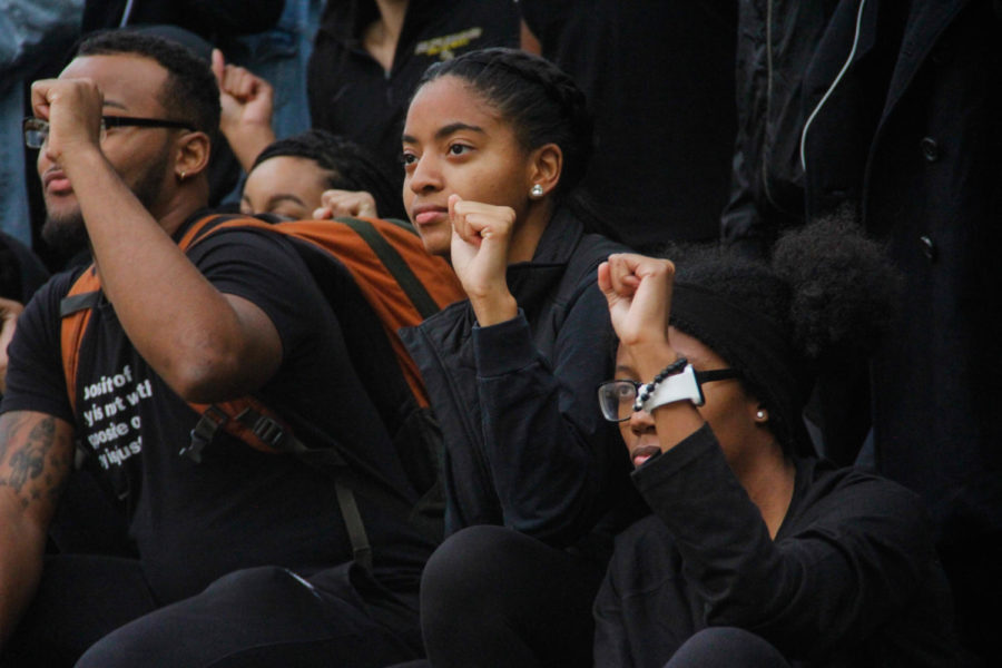 ISU students pose for a picture while participating in the PWI Blackout on Oct. 4 outside Carver Hall. Students were asked to wear all black clothing and Nike apparel in support of Colin Kaepernicks rally against police brutality and social injustice across America.
