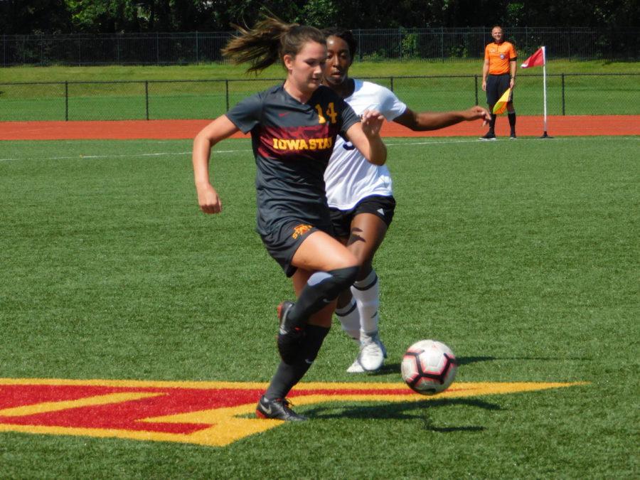 Freshman defender Taylor Bee running with the ball with a Milwaukee player chasing after her in the middle of the field in the Iowa State girls soccer game against the Milwaukee Panthers ending in a tough 3-2 loss on Sept. 9.