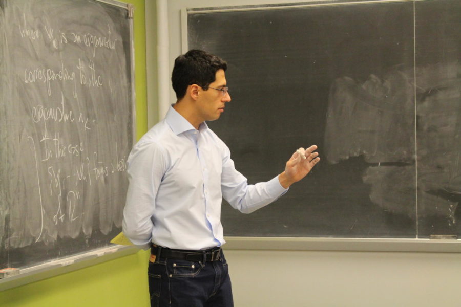 Pablo Raúl Stinga, assistant professor of mathematics, teaches his students new math material on Oct. 25 in Carver Hall. Stinga was selected by Lathisms as the Oct. 14 Mathematician of the Day during a special campaign featuring Latinxs and Hispanics in mathematical science.