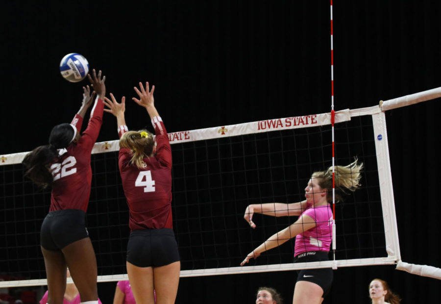 Right side Eleanor Holthaus spikes the ball during the volleyball game against University of Oklahoma at Hilton Coliseum on Oct. 3. The Cyclones lost 3-1.