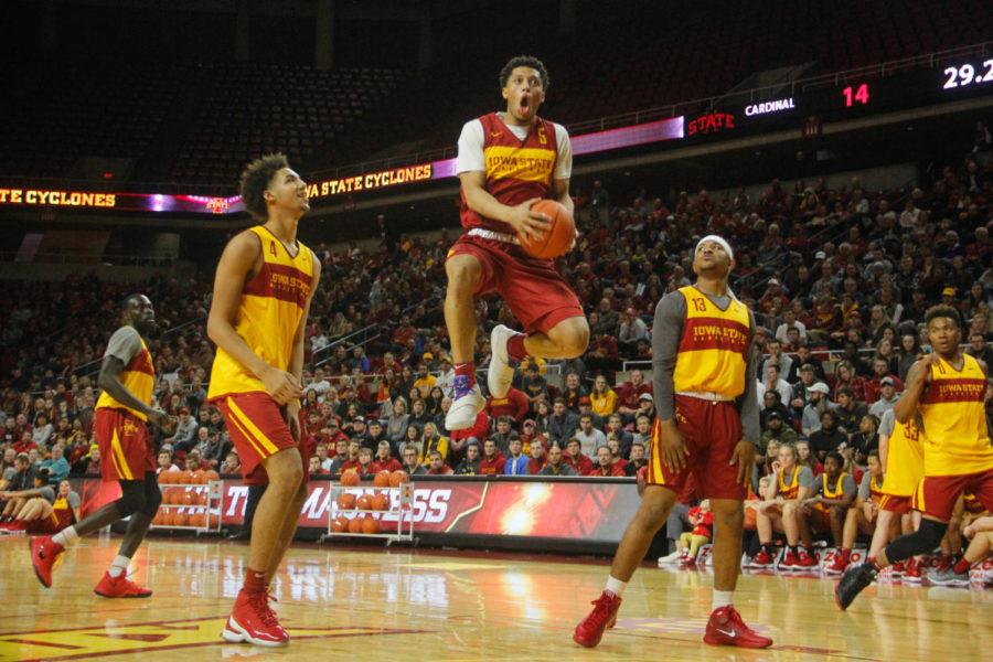 Sophomore Lindell Wigginton flies into a dunk during a scrimmage at Hilton Madness on Oct. 12 at the Hilton Coliseum.