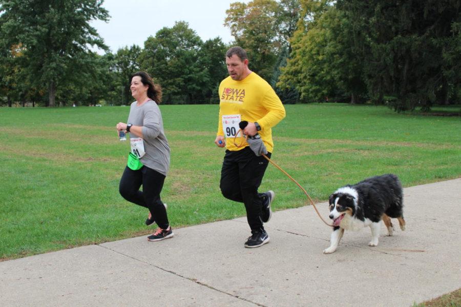 Participants make it to the final stretch of the Paws to Cure Cancer 5K held north of the campanile Oct. 6. The 5K is a fundraiser for the Boo Radley Foundation which strives to promote comparative medicine because dogs suffer from many of the same diseases as humans.